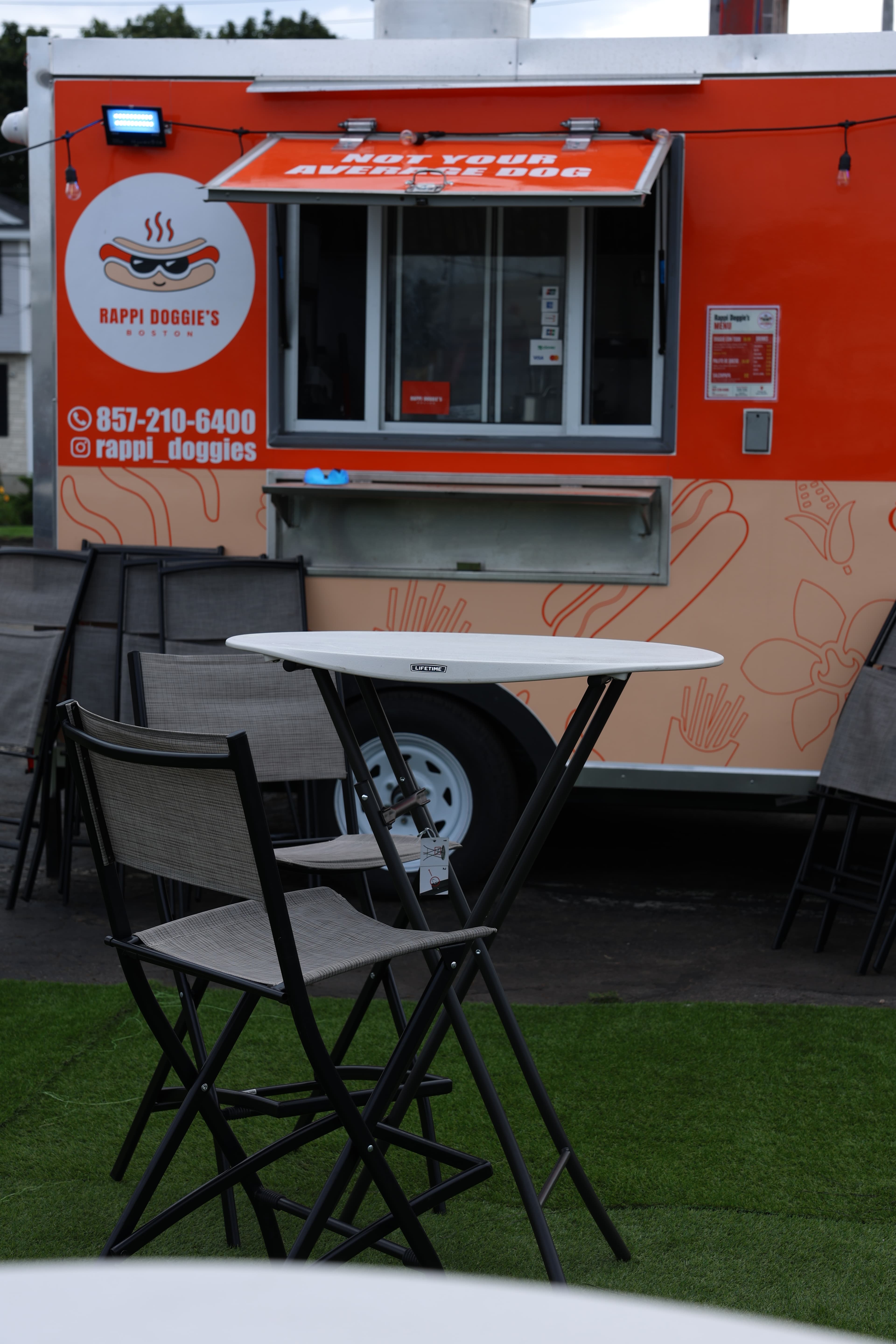 The finished orange Rappi Doggie's food truck set up for service