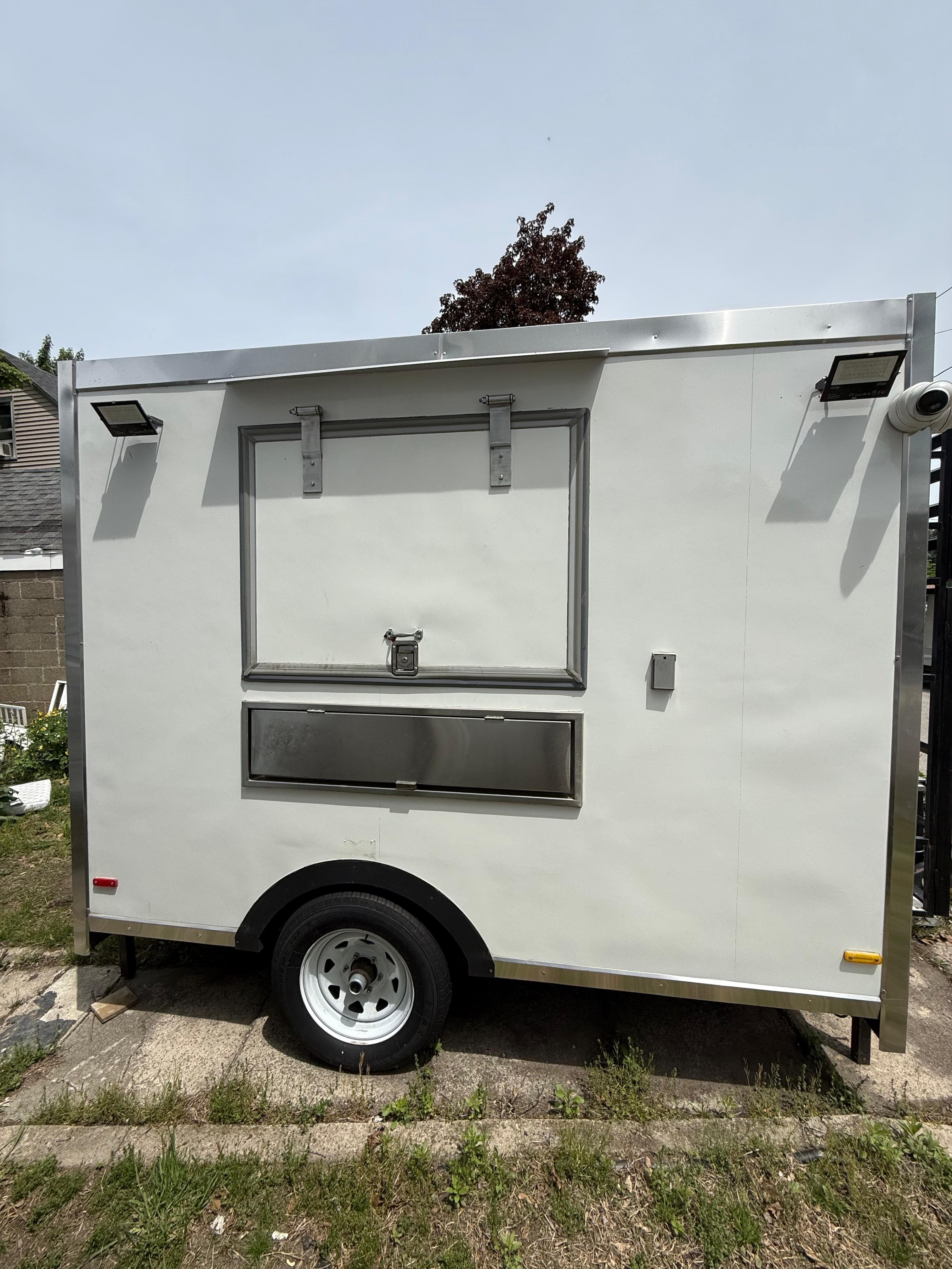 The white Rappi Doggie's food truck when Evan and Angelli first bought it